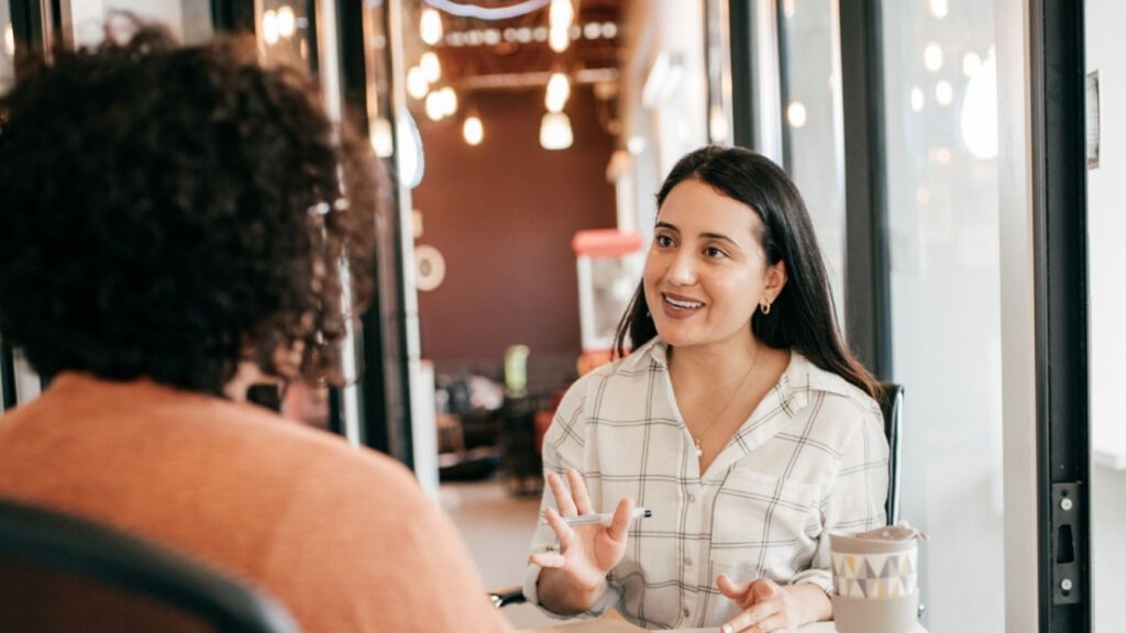 Woman Interviewing Individual