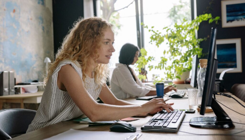 Woman Typing on a Keyboard