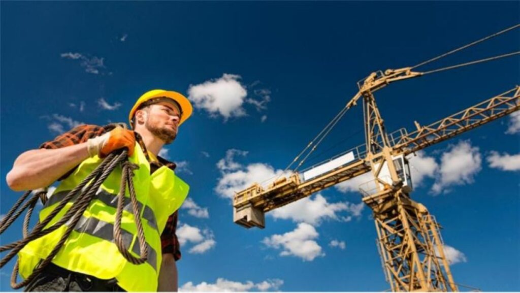 Construction Worker and Crane at the background